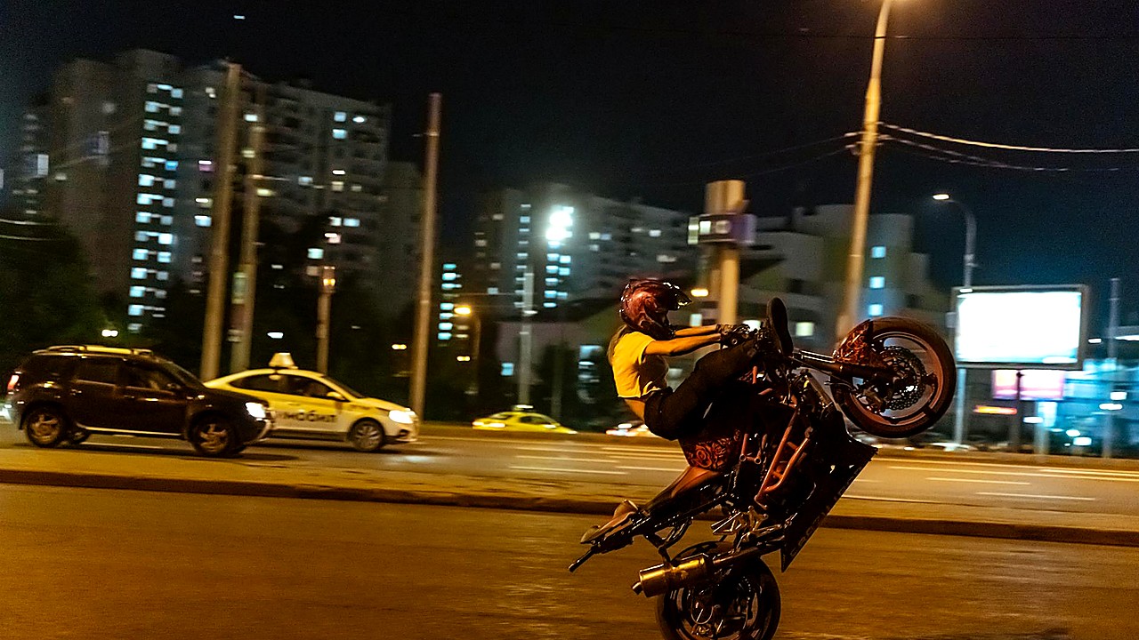 Motorcyclist Seriously Hurt As Bike Hangs From Traffic Light